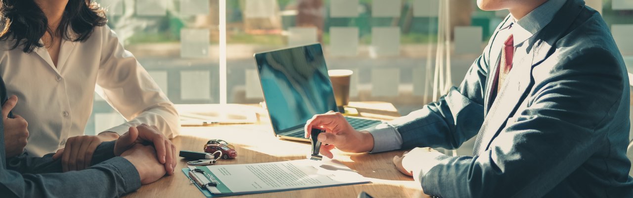 People sitting around a desk having a meeting
