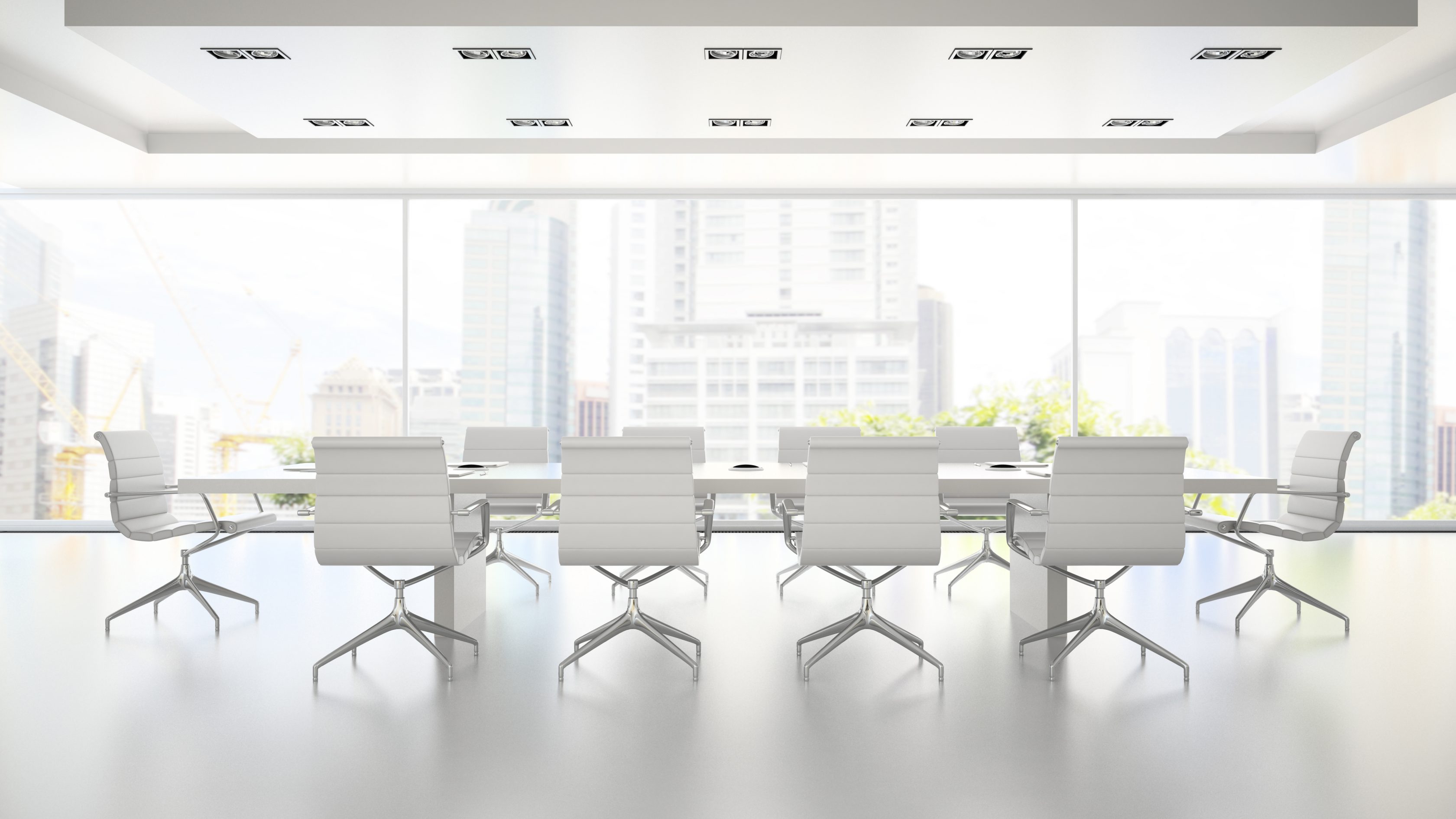 An empty boardroom with a white theme